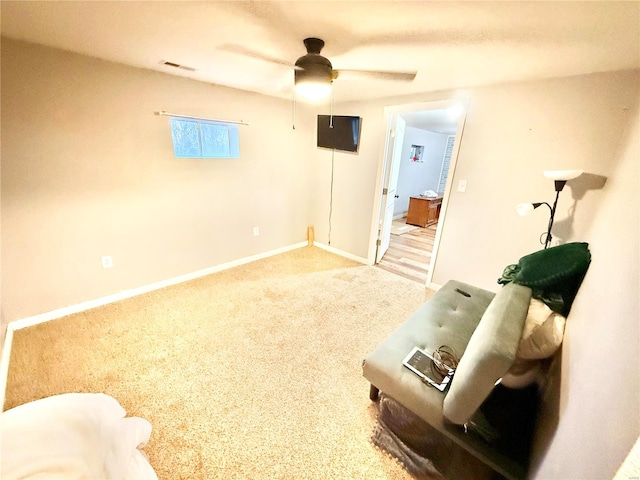 interior space with ceiling fan