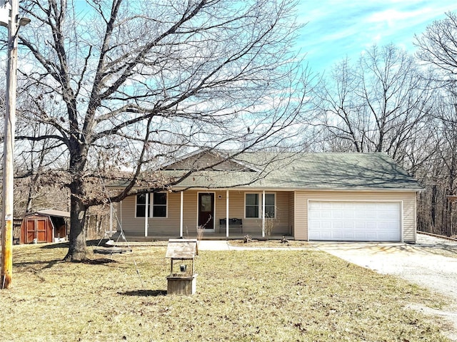 ranch-style home with driveway, a garage, a porch, a shed, and a front lawn