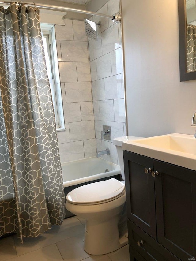 full bathroom with tile patterned flooring, vanity, toilet, and shower / bath combo with shower curtain