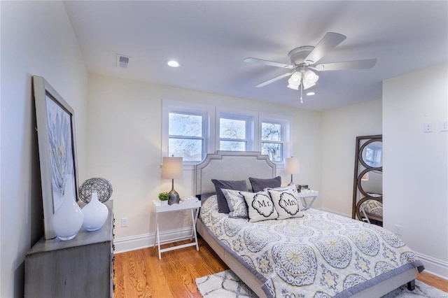 bedroom with ceiling fan and light hardwood / wood-style flooring