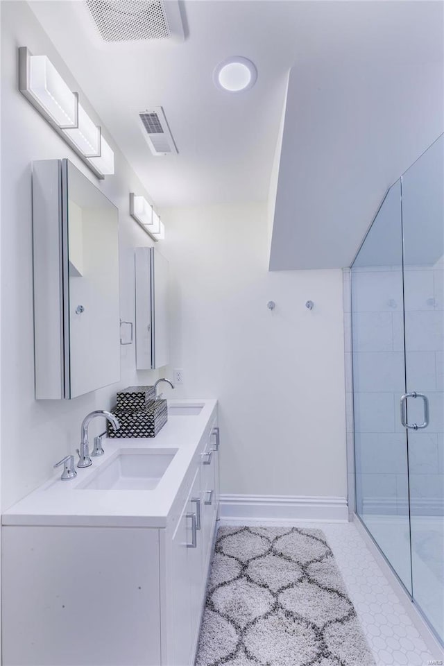 bathroom with vanity and an enclosed shower