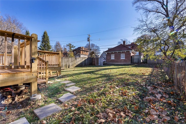 view of yard featuring a wooden deck