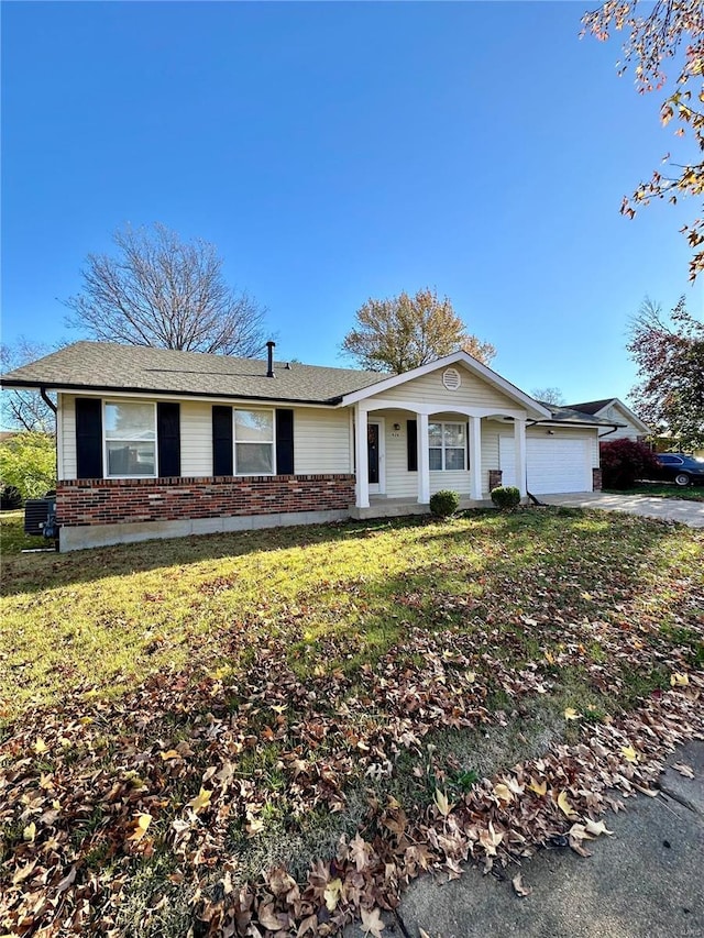 single story home with a front lawn and a garage