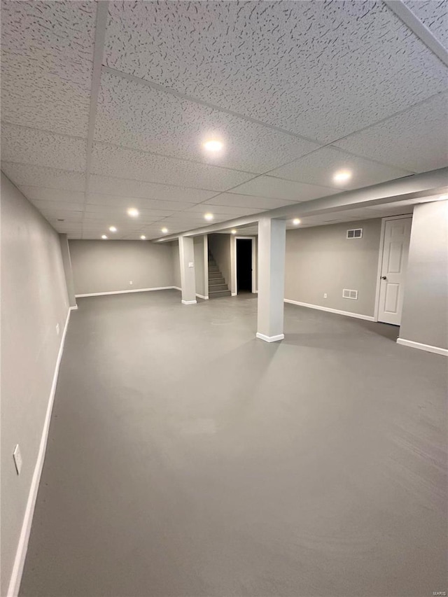 basement featuring a paneled ceiling