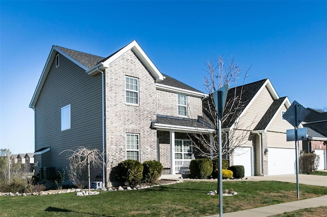 view of front property featuring a front yard and a garage