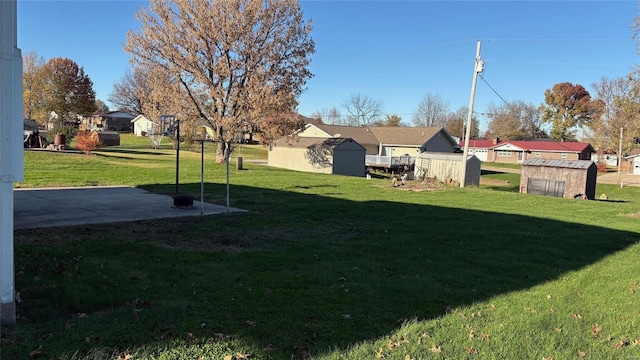 view of yard featuring a patio area and a shed