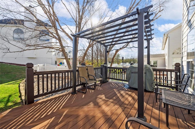 deck featuring a pergola and grilling area