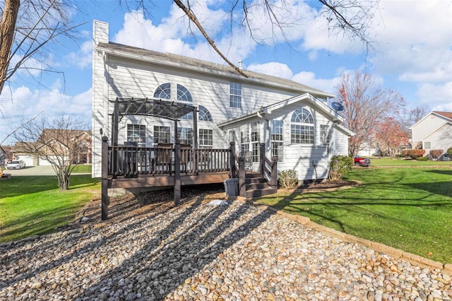 back of property with a deck and a lawn