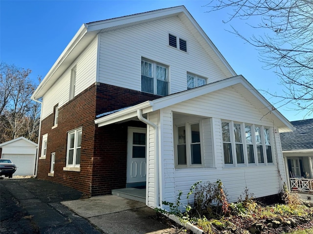 view of front of house featuring an outbuilding and a garage