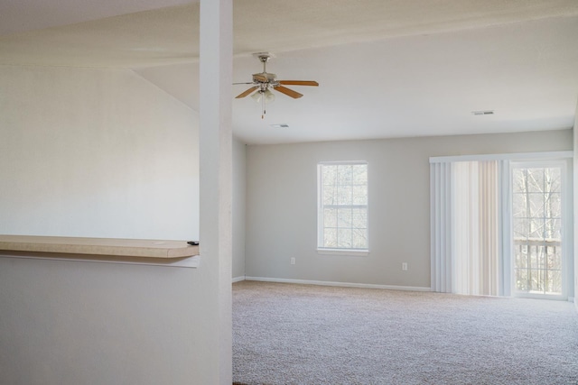 spare room with carpet flooring, ceiling fan, and lofted ceiling