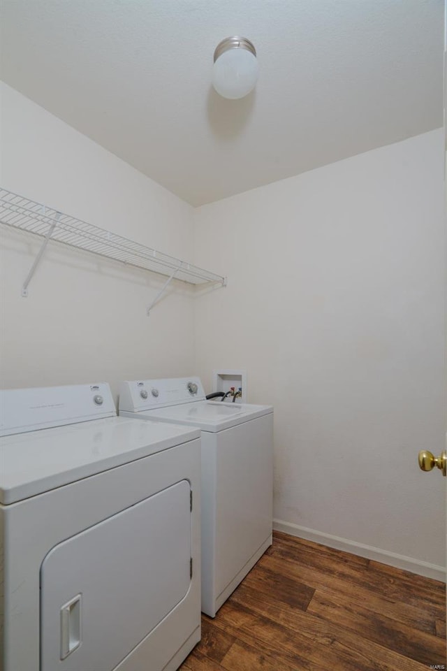 laundry room featuring dark hardwood / wood-style floors and independent washer and dryer