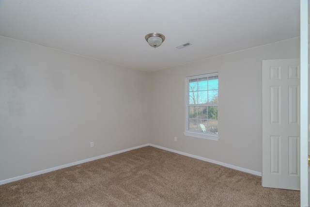 empty room featuring carpet flooring