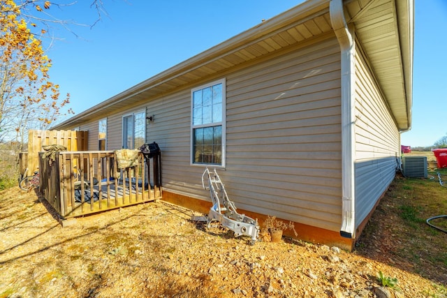 view of side of property with central AC