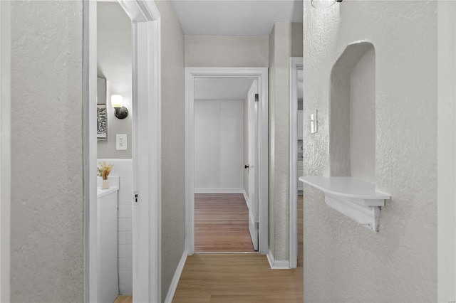 hallway with light wood-type flooring