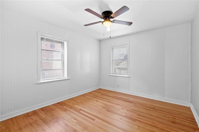 unfurnished room featuring ceiling fan and light wood-type flooring