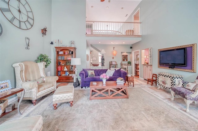 living room with a towering ceiling