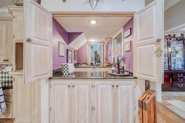 bathroom with vanity, hardwood / wood-style flooring, and radiator heating unit