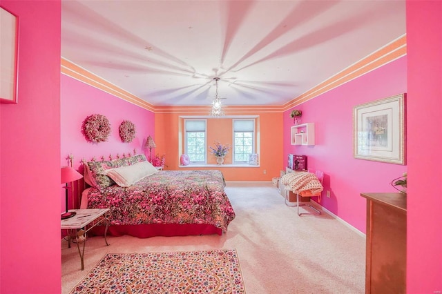 carpeted bedroom with crown molding and baseboards