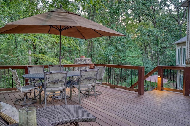 deck with outdoor dining area