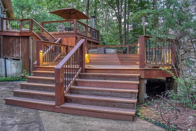 wooden terrace featuring stairs