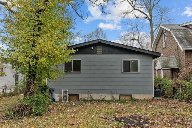 view of side of home with cooling unit