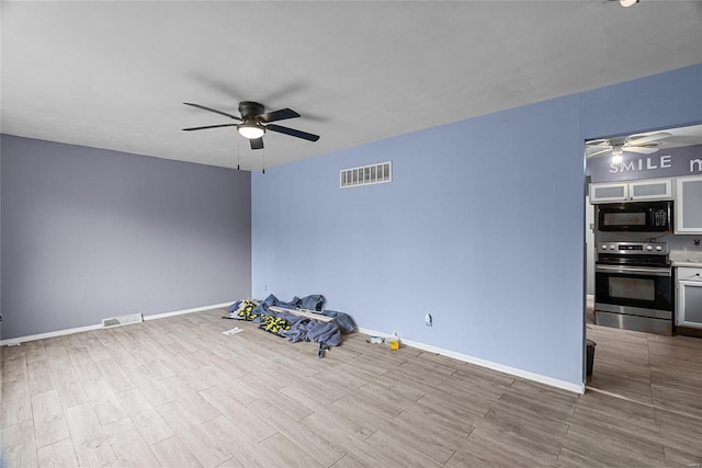 unfurnished room featuring ceiling fan and light hardwood / wood-style flooring