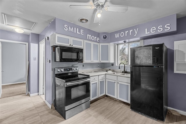 kitchen with decorative backsplash, ceiling fan, sink, black appliances, and white cabinetry