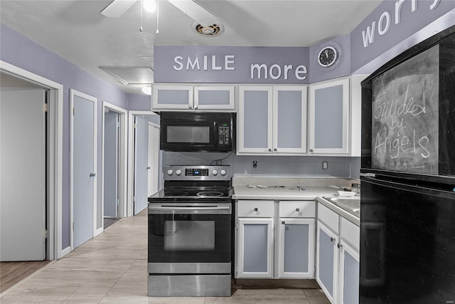 kitchen with white cabinetry, stainless steel range with electric stovetop, and ceiling fan