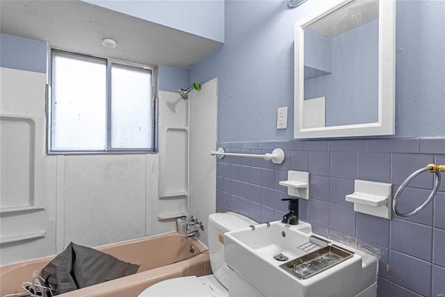 bathroom with shower / bathtub combination, tile walls, and toilet