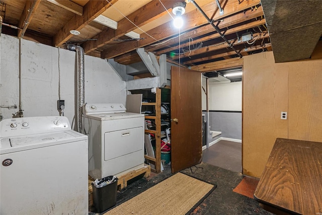 clothes washing area with washing machine and dryer