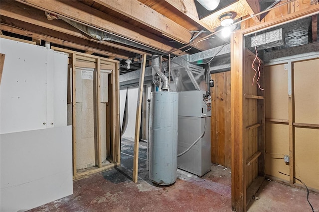 basement featuring gas water heater and heating unit