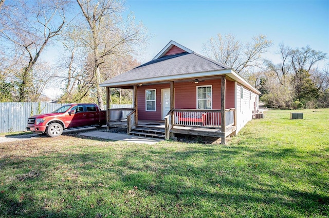 view of front of house with a porch and a front lawn