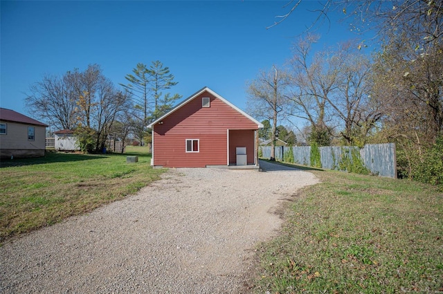 exterior space with a lawn and an outbuilding