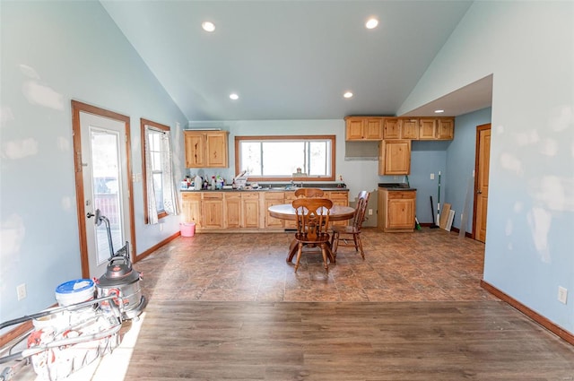 kitchen featuring dark hardwood / wood-style flooring and high vaulted ceiling