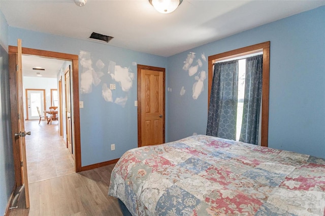 bedroom featuring wood-type flooring