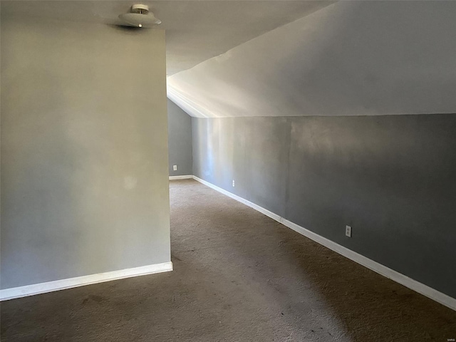 bonus room with carpet floors and vaulted ceiling