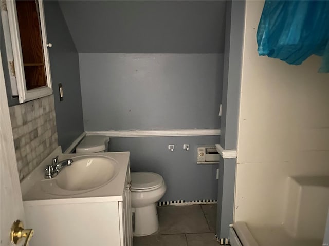 bathroom with tile patterned floors, vanity, and toilet