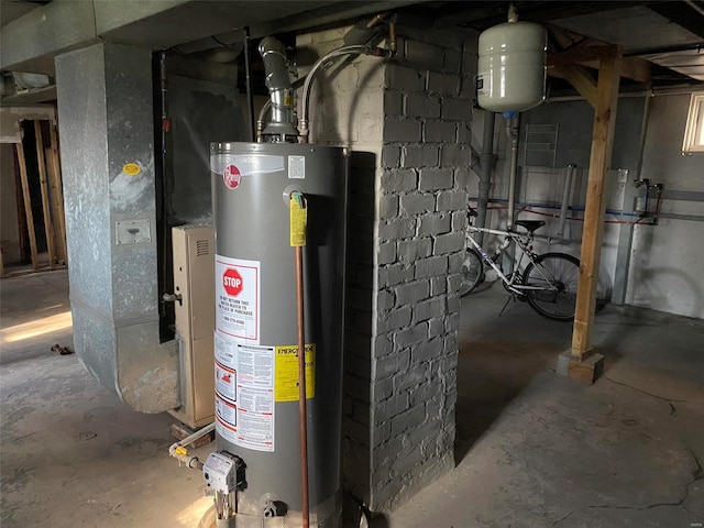 utility room featuring heating unit and water heater