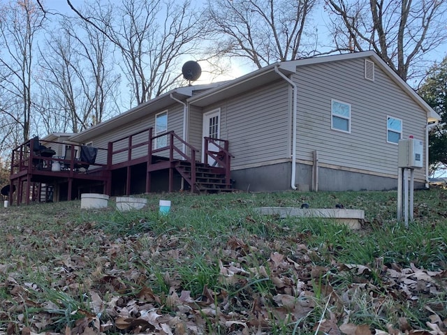 view of home's exterior featuring a deck