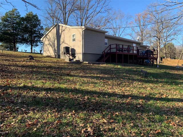 exterior space featuring a yard and a deck