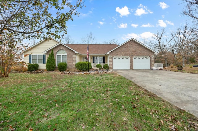ranch-style house featuring brick siding, a front lawn, concrete driveway, and a garage