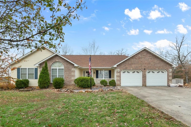 ranch-style home with a front lawn, a porch, and a garage