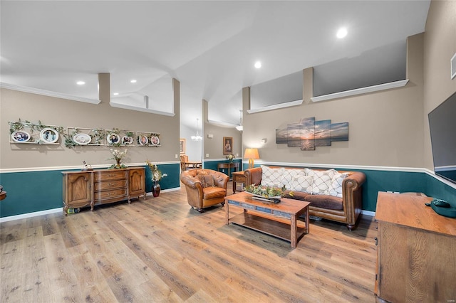 living room with high vaulted ceiling, light hardwood / wood-style flooring, and crown molding