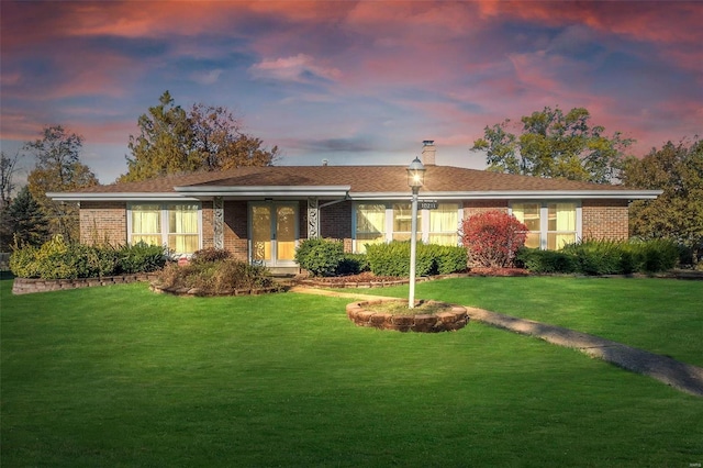 view of front of house with a lawn