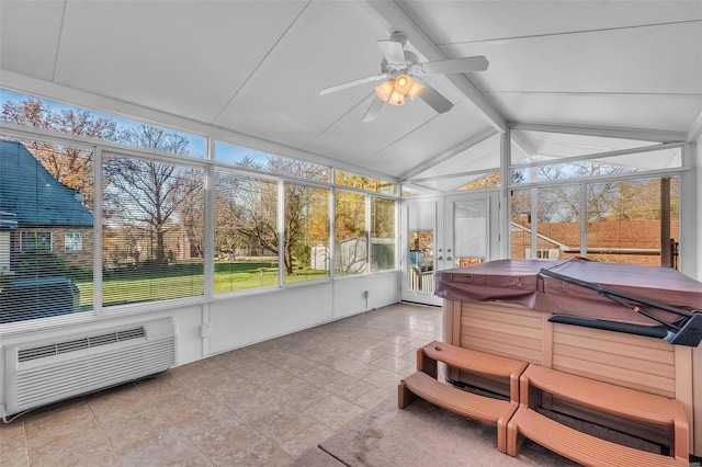 sunroom with a healthy amount of sunlight, vaulted ceiling with beams, an AC wall unit, and ceiling fan