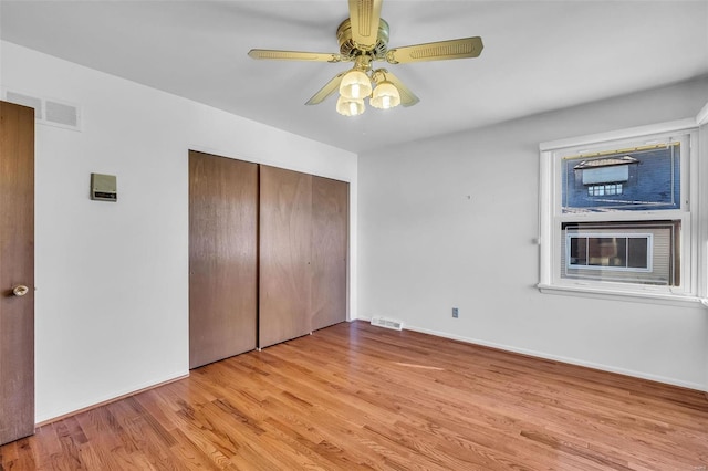 unfurnished bedroom featuring a closet, ceiling fan, and light hardwood / wood-style floors