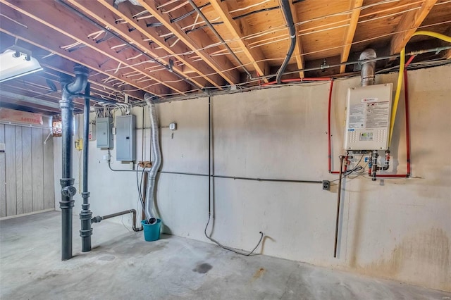 basement featuring electric panel and water heater