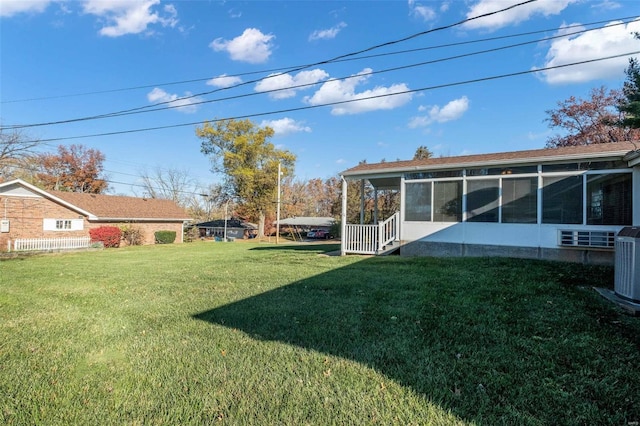 view of yard featuring a sunroom