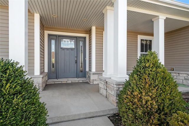 view of exterior entry with covered porch