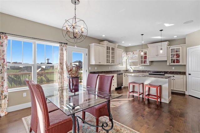 dining space with dark hardwood / wood-style floors and a wealth of natural light